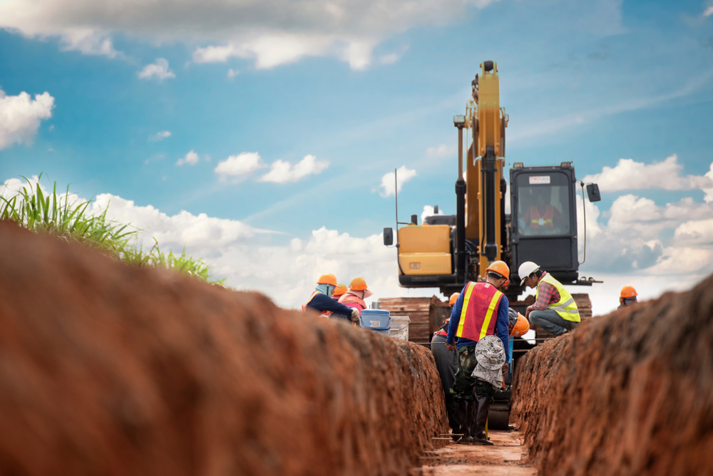Image of a group of construction workers working on a road